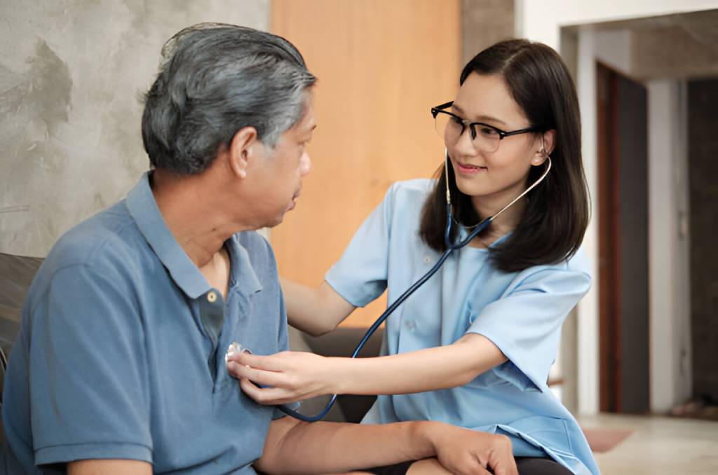 DHcare Caregiver giving services to one of their clients or patients